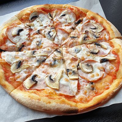 Пицца с ветчиной и грибами в БамБуши по цене 585