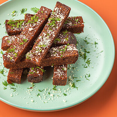 Гренки с зеленью, пармезаном и чесночным маслом в Сушилка по цене 235 ₽