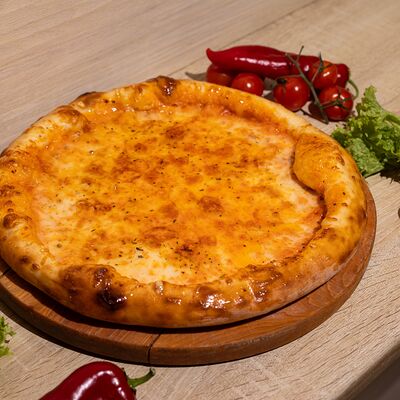 Пицца Четыре сыра в Плюшка ватрушка по цене 650 ₽