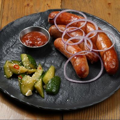 Ассорти колбас с аджикой и битыми огурцами в Brasserie Kriek по цене 1590 ₽