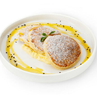 Панкейки с тропическим соусом в Кулинария Патрик & Мари по цене 308 ₽