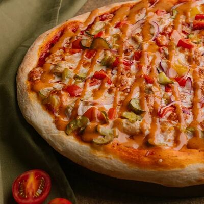 Пицца По домашнему в Krutli по цене 699 ₽