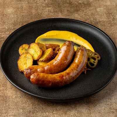 Колбаса, четыре перца с молодым картофелем, тушеной капустой и горчичным соусом в Егерь по цене 1310 ₽