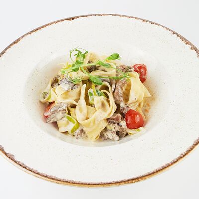 Тальятелле с говядиной в Нью-Йорк пицца и гриль по цене 670 ₽