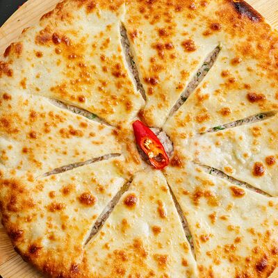 Осетинский пирог Фынджин в Голд Сити по цене 1150 ₽