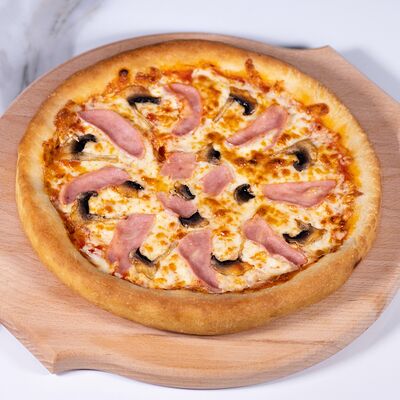 Пицца Ветчина с грибами в Евразия по цене 499 ₽