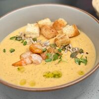 Тыквенный крем суп с креветкой и домашними крутонами с базиликом и зеленым маслом в Бульвар