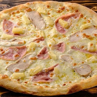 Пицца с куриным филе и ананасом в Чили пицца по цене 870 ₽