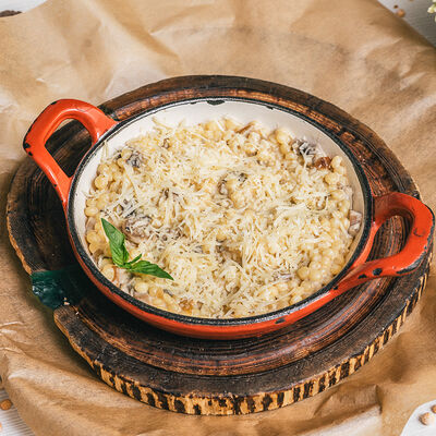 Птитим с грибным миксом и сливочным соусом в Место Про Тесто по цене 435 ₽