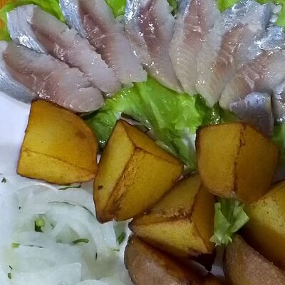 Картофель по-деревенски с селедочкой в Каприз по цене 289 ₽