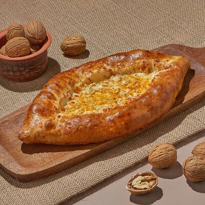Хачапури лодочка с орехом и сырами в Dostaевский по цене 688 ₽
