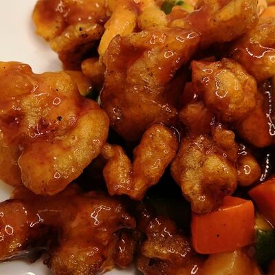 Курица в кисло-сладком соусе с ананасами в Момо по цене 690