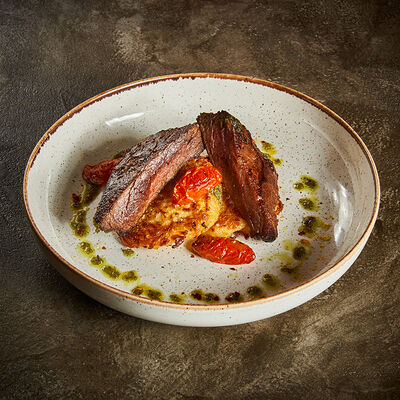 Телятина на картофельном дранике с соусом песто в Корчма по цене 1120 ₽