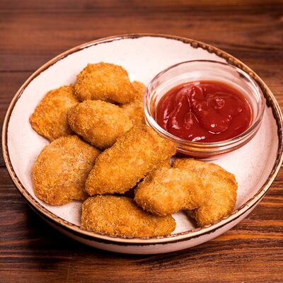 Куриные наггетсы в Трактир Колесо по цене 407 ₽