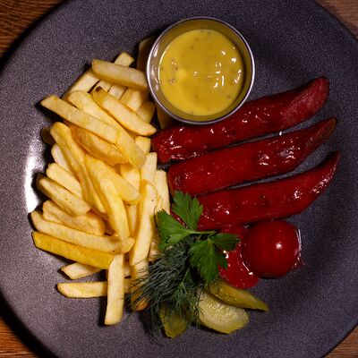 Колбаска из оленины в Кнедлик по цене 595 ₽