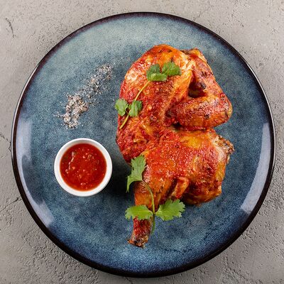 Цыпленок с чесноком в Мангал по цене 530 ₽