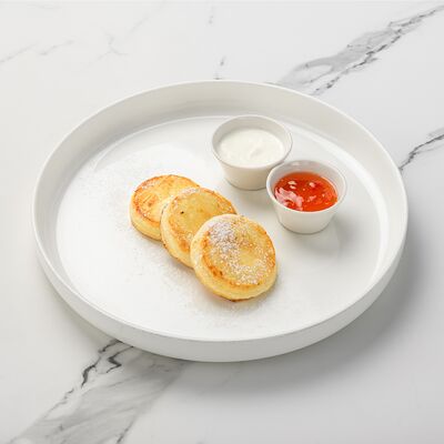 Сырники со сметаной и джемом в Bruni Prosecco Bar по цене 490 ₽