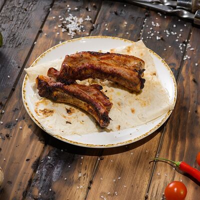 Шашлык из свиных ребер 200г в Ресторан Мангал по цене 400 ₽