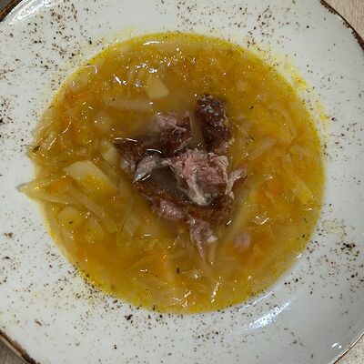 Щи из квашеной капусты с копчеными свиными ребрами в Eezy One Pizza по цене 449 ₽