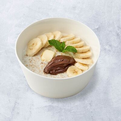 Овсяная каша с бананом и шоколадом в Vaffel по цене 430 ₽