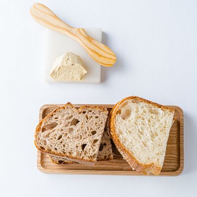 Французский хлеб с маслом из трюфеля в Wine Region по цене 520 ₽