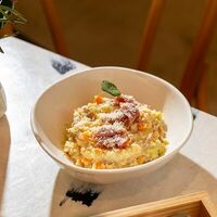 Каша пшенная с томленой уткой и выдержанным сыром в MAYAR