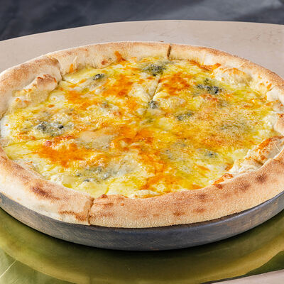 Пицца 4 сыра в Муссоны по цене 1120 ₽