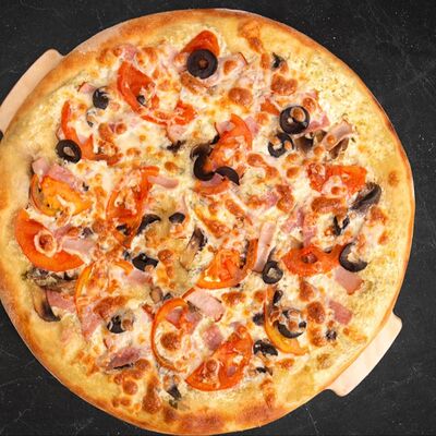 Фирменнаяв Пицца Семейная точка по цене 700 ₽