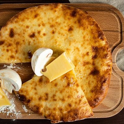 Осетинский пирог с грибами в Хинкали у Лали по цене 450 ₽