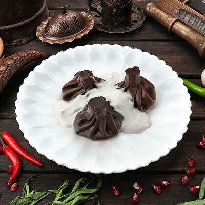 Шоколадные хинкали с кокосовым соусомв Генацвале на Арбате - грузинский ресторан по цене 750 ₽