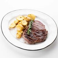 Стейк рибай категории прайм на гриле в Итальянец