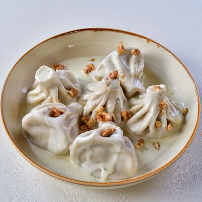 Мини-хинкали из трех видов сыра с соусом горгонзола в Колхида Palace по цене 900 ₽