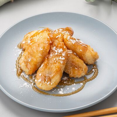 Бананы в кокосовой темпуре в Суши хит по цене 535 ₽