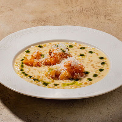 Птитим с лангустинами в сливочном соусе в Cafe Sisi по цене 1000 ₽