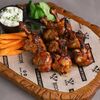 Куриные крылышкив Bizon Grill Pub по цене 541