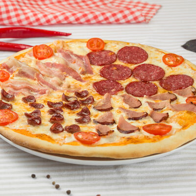 Пицца Четыре мяса в Пиццерия Capriccio по цене 911 ₽