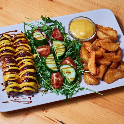 Колбаски австрийские с картошкой по-деревенски в Дом у дороги по цене 550 ₽