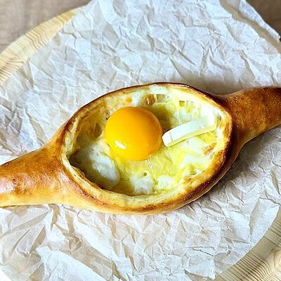 Хачапури по-аджарски с сыром и картофелем в Сули по цене 240 ₽