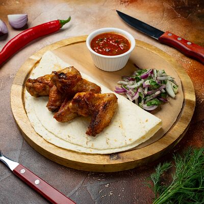 Куриные крылья на мангале в Чебуречная & Шаурма по цене 380 ₽