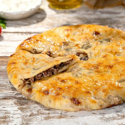 Говядина с грибами 850 г в Пиросетия Осетинские пироги по цене 1010 ₽