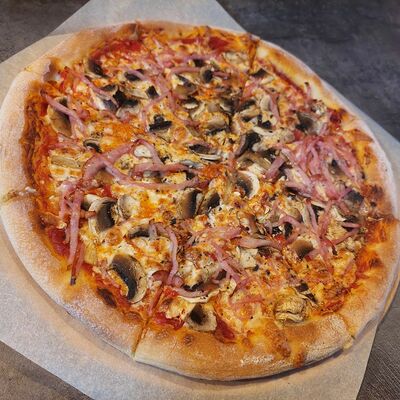 Ветчина-грибы в Atomic pizza по цене 950 ₽