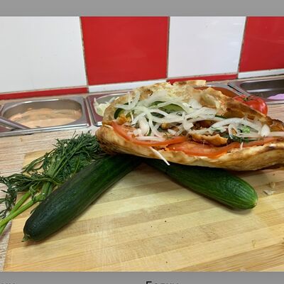 Шаурма в пите с колбаской и курицейв Dana по цене 590 ₽