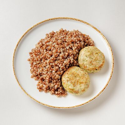 Котлетки из куриного бедра с гарниром в Buana cafe по цене 850 ₽