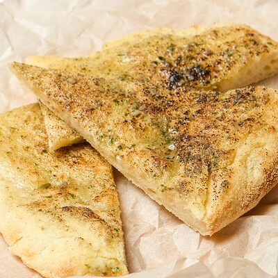 Ароматный чесночный хлеб в Cafeshion по цене 190 ₽