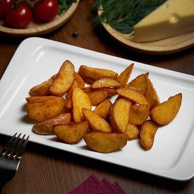 Картофель по-деревенски в The Кухня по цене 200 ₽