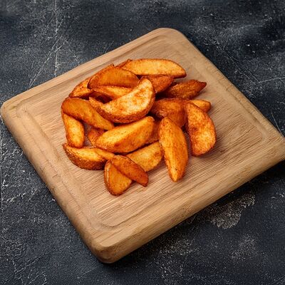 Картофель по-деревенски в Кухня на Углях по цене 185 ₽