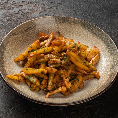 Картофель жареный со свининой в Мираж по цене 690 ₽