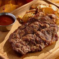 Отбивная из свинины в BBQ Beer Restaurant