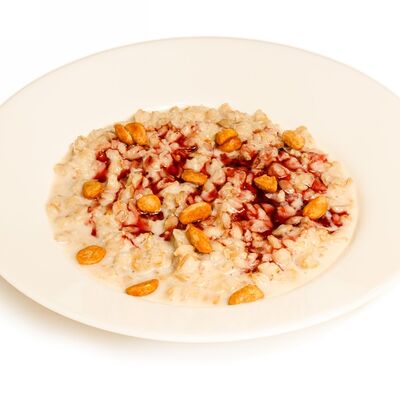 Каша овсяная с топпингом из лесных ягод и карамелизированным арахисом в Абсолют по цене 200 ₽