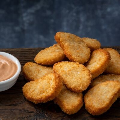 Куриные наггетсы в Вкусный домик по цене 230 ₽